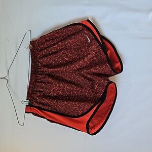 Red and black Nike Dri-FIT shorts